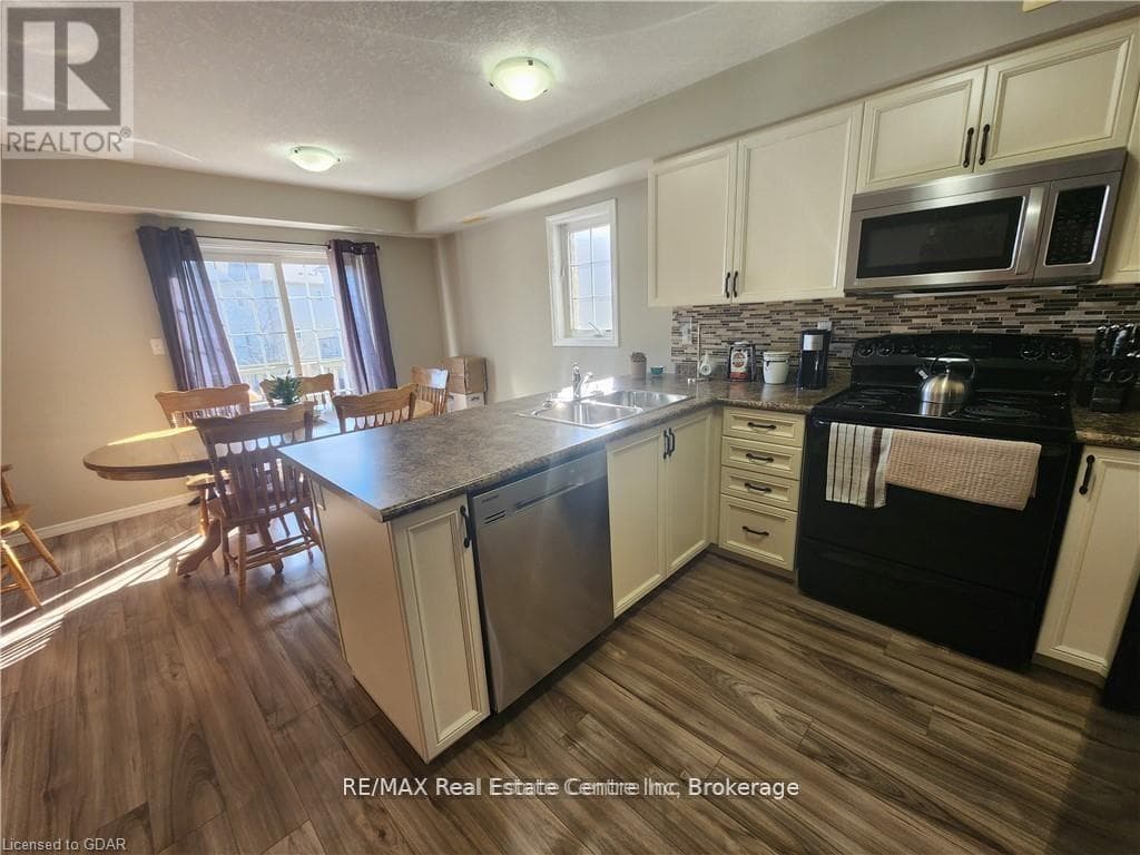 Single Family at 95- 35 MOUNTFORD Drive, Guelph (Grange Road), Ontario - Photo 6 - RE/MAX Garden City Realty
